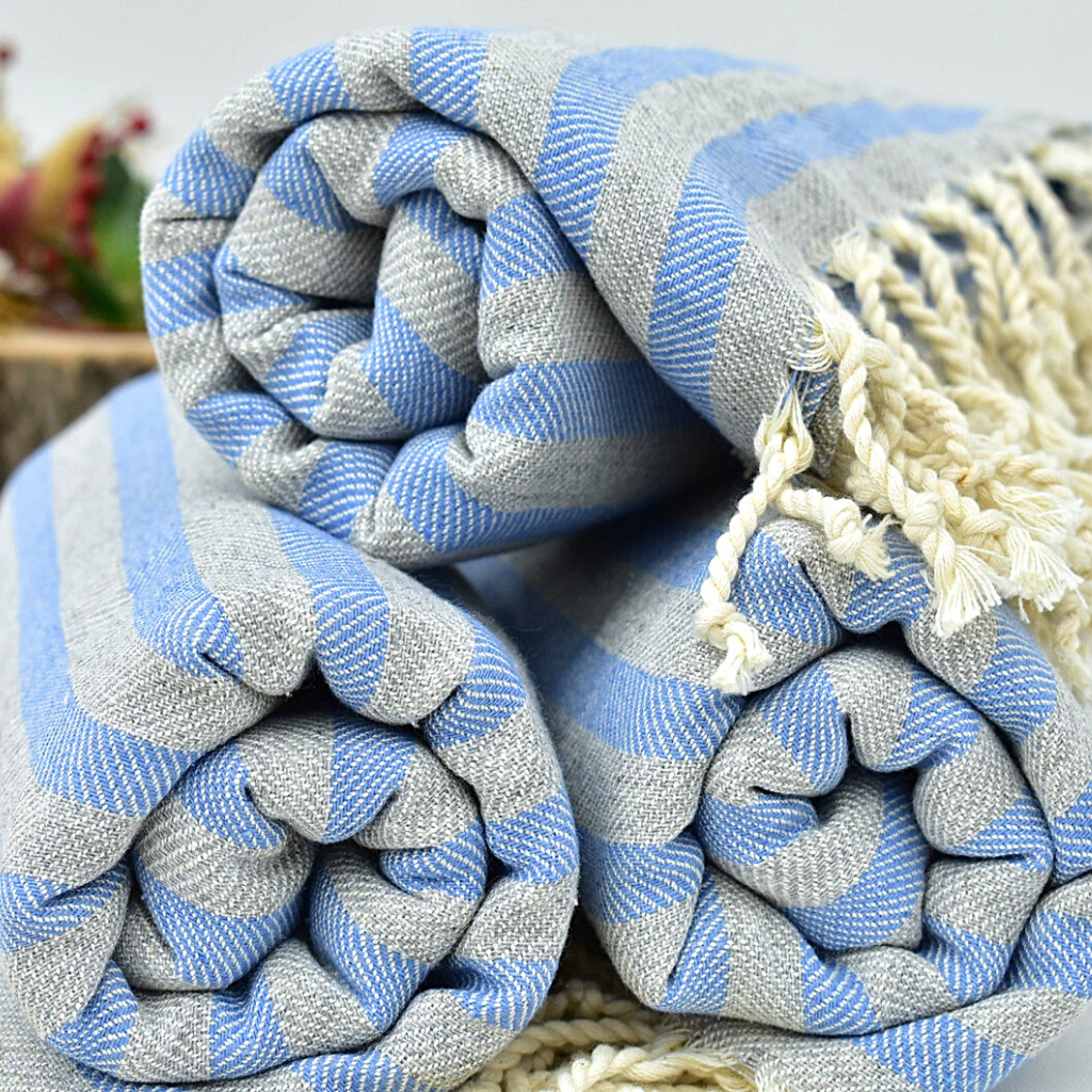 Blue and grey striped folded DUSK Turkish Towels