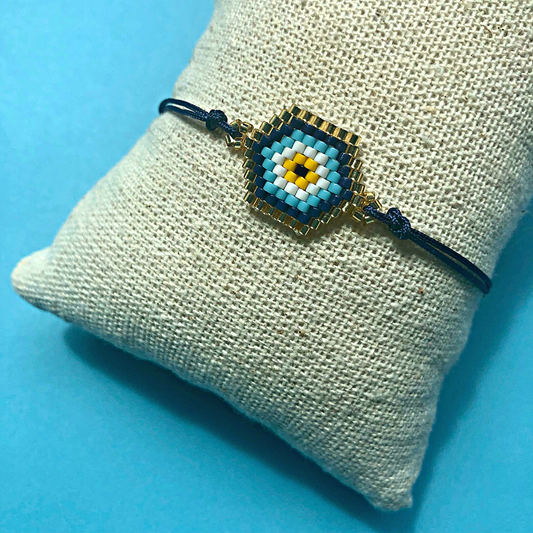 MARDIN EVIL EYE miyuki beads cord bracelet on jute display pillow