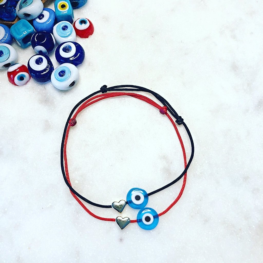Stacked NAZAR HEART Evil Eye Cord Bracelets on black and red cords with heart-shaped metal charms