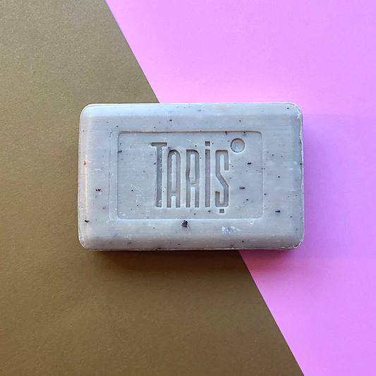 Unpacked olive oil with olive leaves exfoliating bar soap