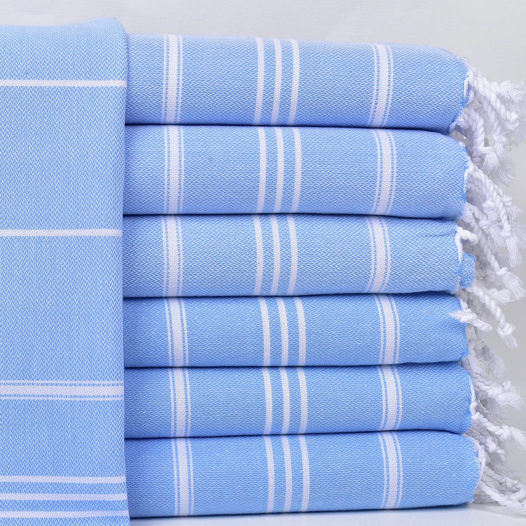 Set of light blue STRIPY Turkish Kitchen Towels with white stripes and tassels on a white background