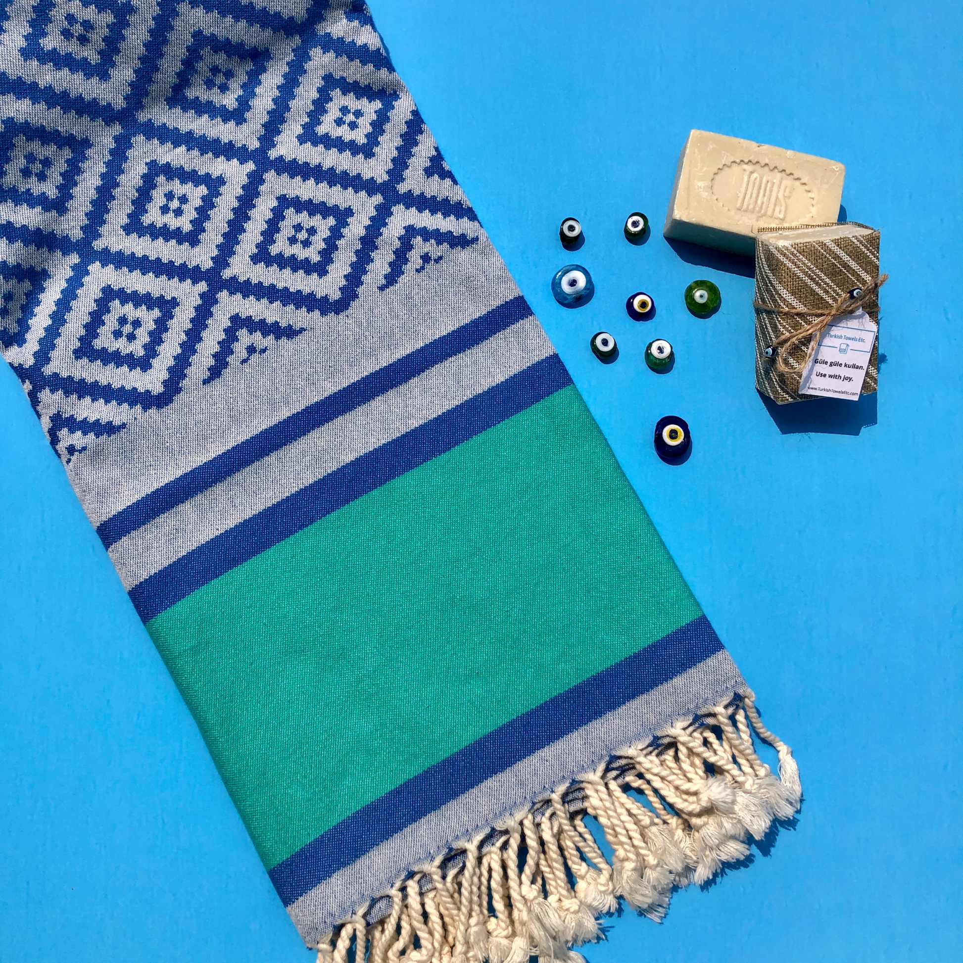 DIVAN Turkish Towel with olive oil soap bars and Turkish evil eye beads