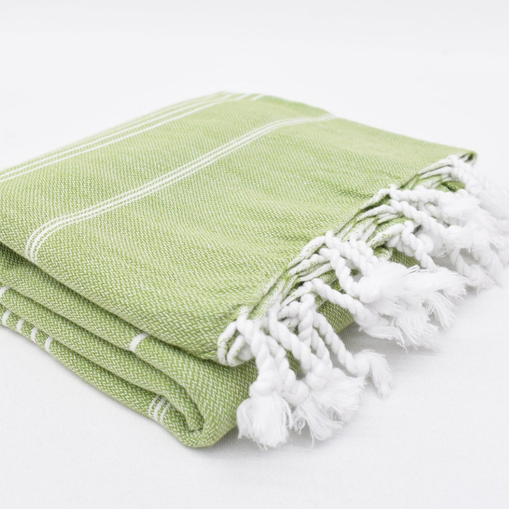 Folded CLASSIC Turkish Towel in olive green with white stripes and fringes
