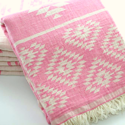 Folded reversible DENIZLI KILIM Double-Sided Turkish Bath Towels in pink