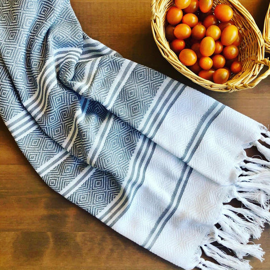 GREY SULTAN Turkish Kitchen Towel next to basket of tomatoes