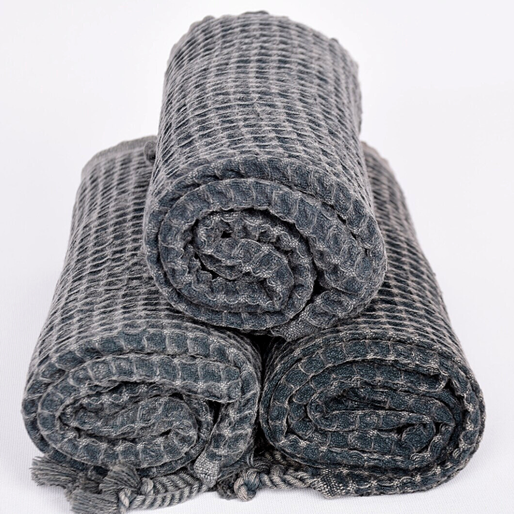 Folded and stacked black WAFFLE Turkish Hand Towels