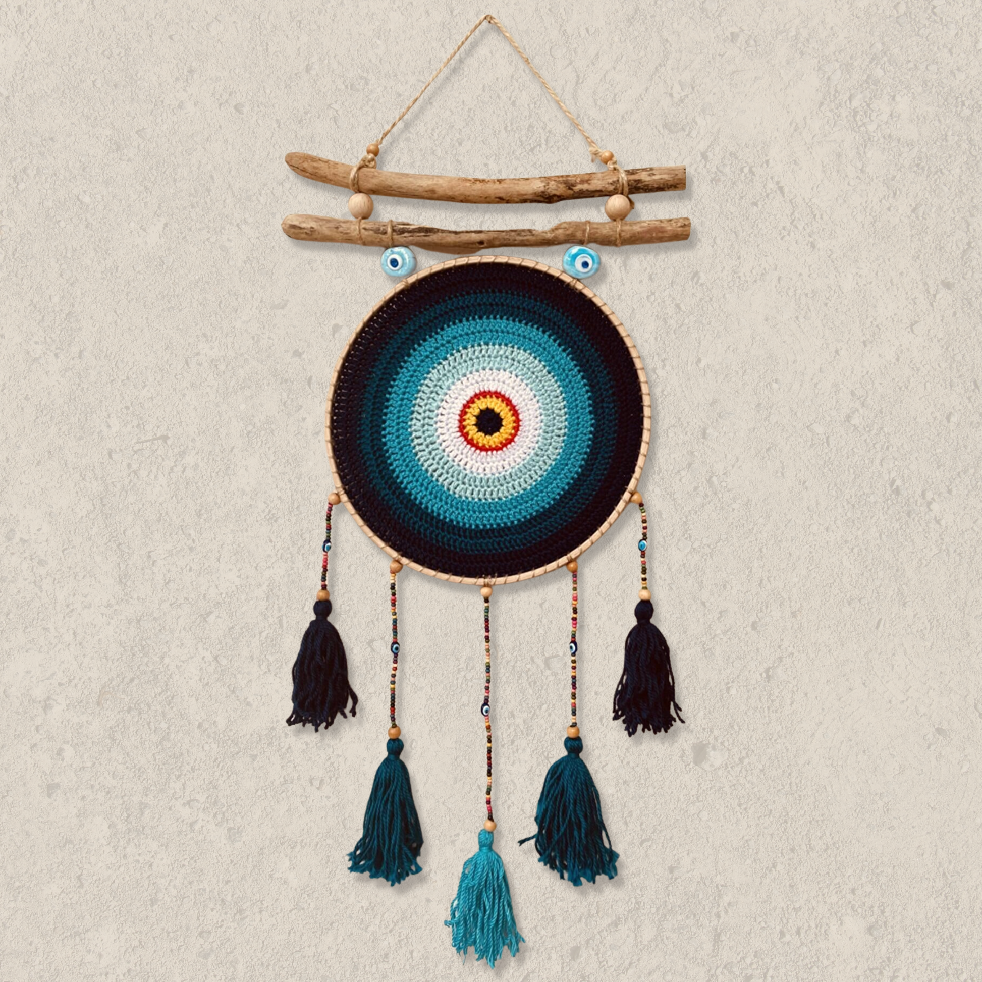 Large blue evil eye dreamcatcher hanging on a wall