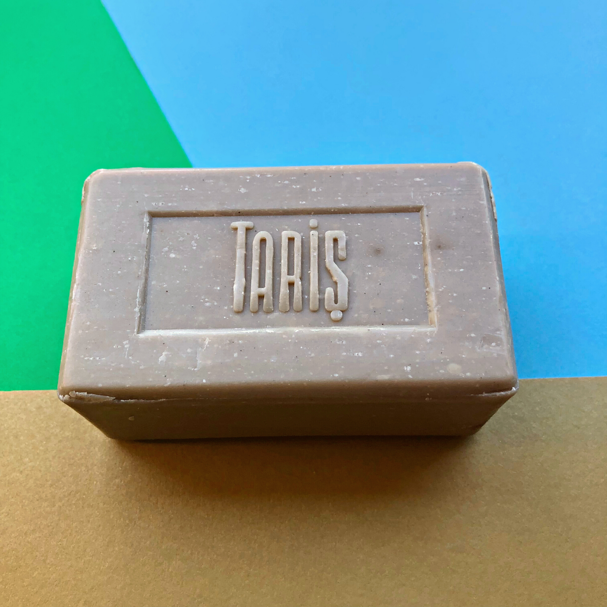 OLIVE OIL Soap with Mud on colourful background