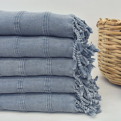 Denim colour STONEWASHED Turkish Towels next to basket