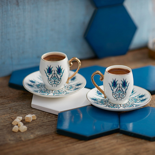 IZNIK Turkish Coffee Cups with Turkish delights on wooden and blue background