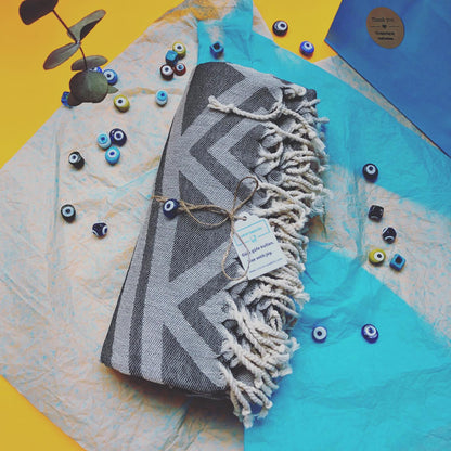 Pickup order for URBAN Turkish Towel wrapped with evil eye beads, turquoise tissue paper with blue paper bag