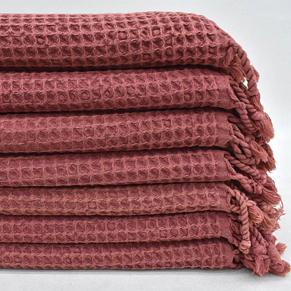 Folded WAFFLE Turkish Hand Towels in rust dark red colour